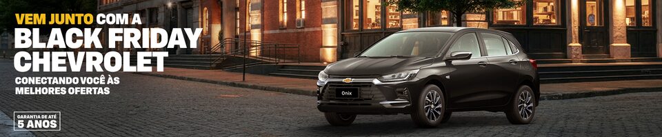  Onix Chevrolet estacionado em uma rua da cidade à noite. A imagem promove a campanha de Black Friday da Chevrolet.