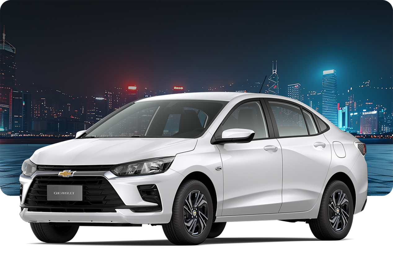 Chevrolet Onix MT Turbo na cor Branco Summit, com fundo noturno e prédios ao longe.