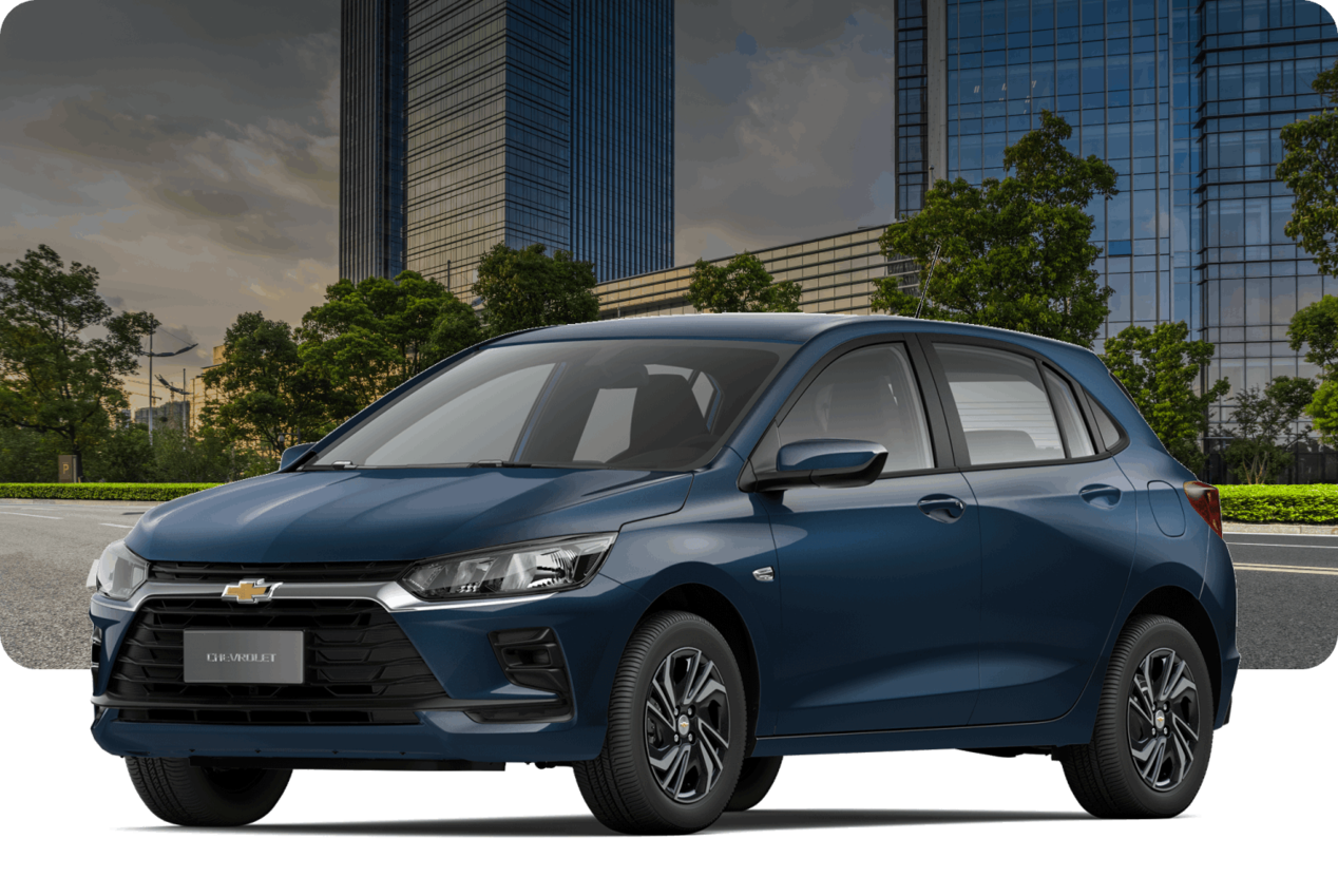 Chevrolet Onix AT Turbo na cor Azul Boreal, com prédios modernos ao fundo.